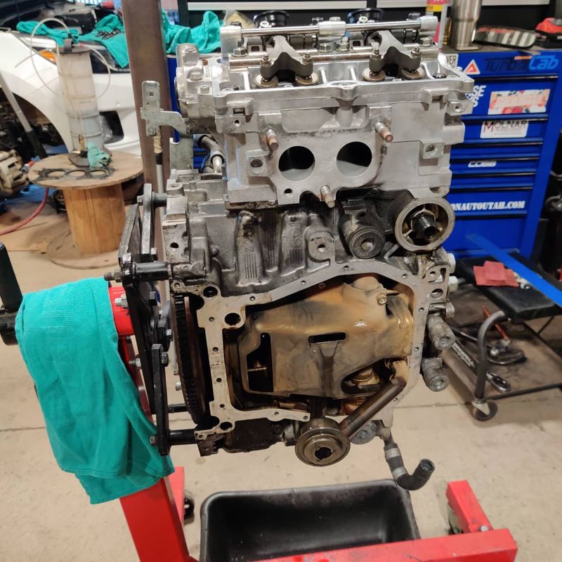 Subaru EJ engine on a stand, partly assembled