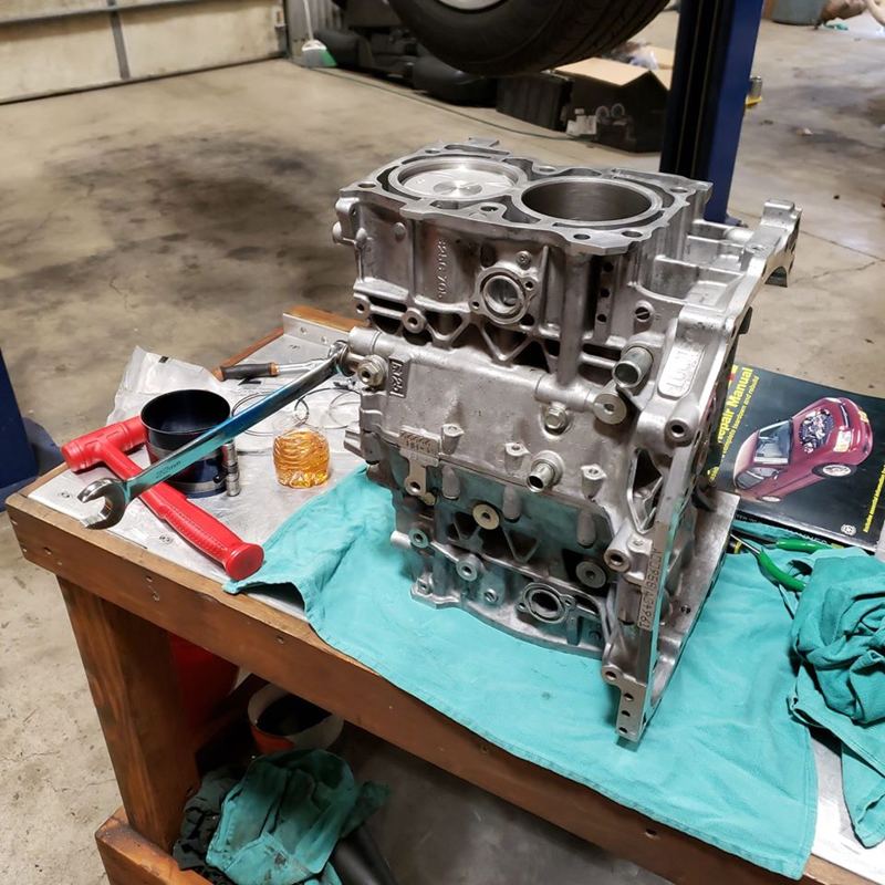 Engine block mid-rebuild on a workbench